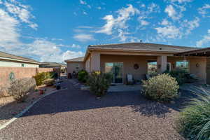 Rear view of property with a patio area