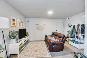 Living room featuring light colored carpet