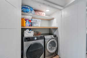 Laundry room featuring washing machine and dryer