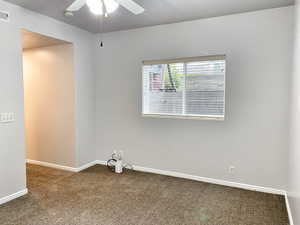 Spare room with carpet floors and ceiling fan