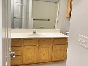 Bathroom featuring vanity and toilet