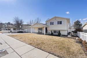 Split level home featuring a garage