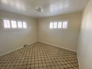 Spare room featuring plenty of natural light