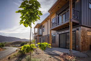 View of home's exterior featuring a balcony and a mountain view