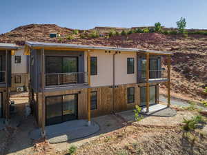 Back of property featuring a balcony