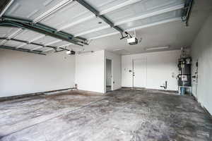 Garage with a garage door opener and water heater