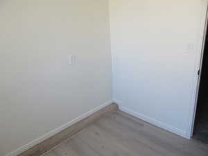 Empty room featuring light wood-type flooring