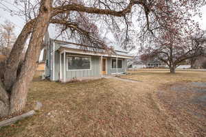 View of front of property featuring a front lawn