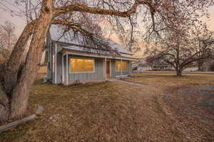 View of front of home featuring a lawn