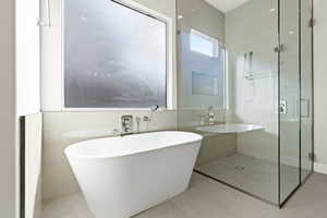 Bathroom featuring separate shower and tub