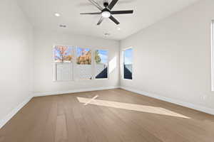 Spare room with light hardwood / wood-style flooring and ceiling fan