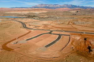 Birds eye view of property featuring a water and mountain view