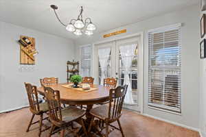 Beautiful French doors leading to an enclosed patio.