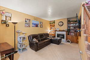 Snuggle up in this cozy living room by your wood burning fireplace.