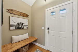 Mudroom featuring wood-type flooring