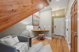 Entryway featuring a chandelier and light hardwood / wood-style floors