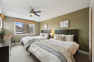 Bedroom featuring carpet floors and ceiling fan