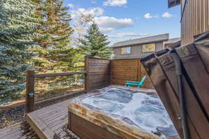 Wooden deck with a hot tub