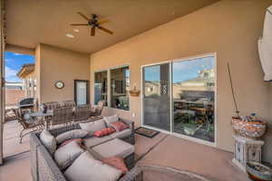 View of patio featuring an outdoor hangout area and ceiling fan