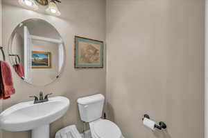 Bathroom featuring sink and toilet