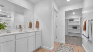 Bathroom featuring vanity and hardwood / wood-style floors