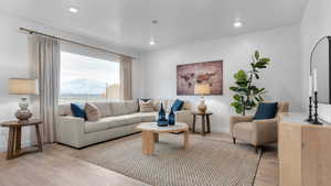 Living room with a mountain view and light wood-type flooring