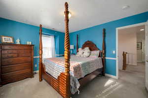 Carpeted bedroom with a textured ceiling