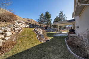 View of yard featuring a patio and central air condition unit