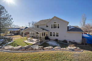 Back of house with a patio, central air condition unit, and a lawn