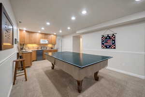 Game room featuring light colored carpet