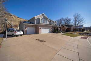 View of front property featuring a garage and a mountain view