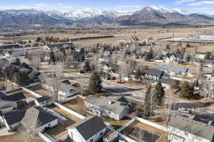 Birds eye view of property with a mountain view