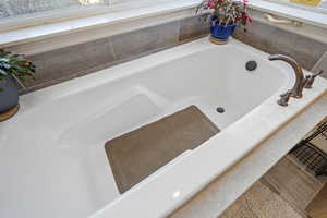 Bathroom with tiled tub