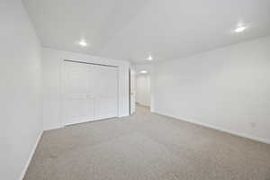 Unfurnished bedroom with a closet and carpet