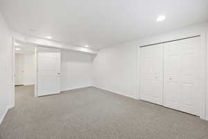 Basement featuring carpet