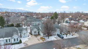 Snowy aerial view featuring a mountain view