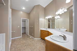 Bathroom with tile patterned flooring and vanity