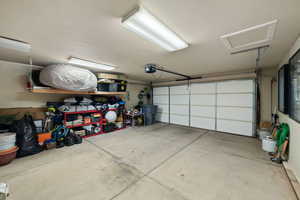 Garage featuring a garage door opener