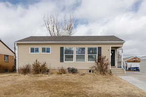 View of front of home featuring a front lawn