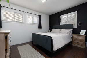 Bedroom featuring dark wood-type flooring