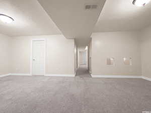 Interior space featuring a textured ceiling