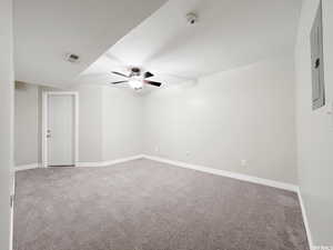 Carpeted empty room with ceiling fan