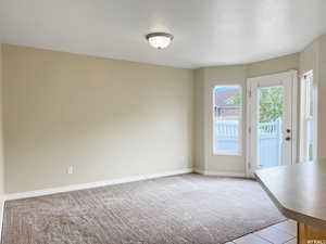 Interior space featuring light colored carpet