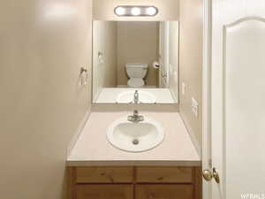 Bathroom featuring vanity and toilet