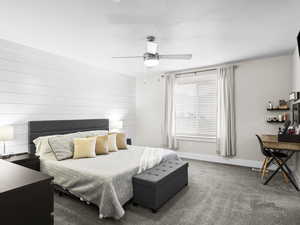 Bedroom featuring ceiling fan and carpet floors