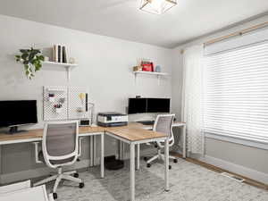 Office space featuring light hardwood / wood-style floors