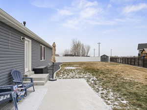 View of patio / terrace featuring a shed