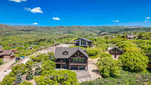 View of subject property featuring a mountainous background