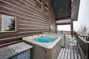 Wooden deck with a hot tub