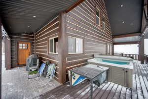 Deck featuring grilling area and a hot tub